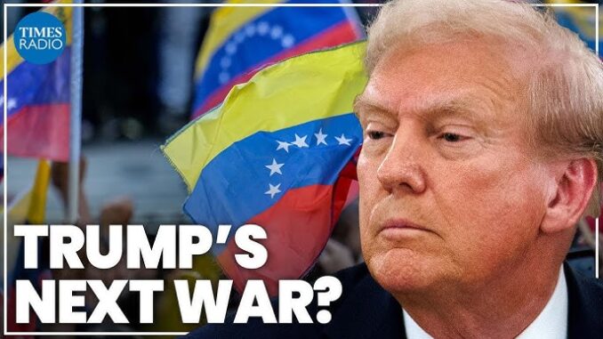 Man with Venezuelan flags in background.