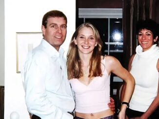 Three people smiling in a room.