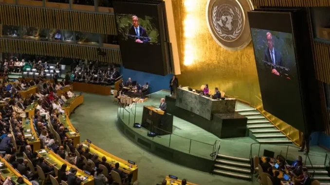 UN assembly hall with speaker at podium. UN assembly hall with speaker at podium.