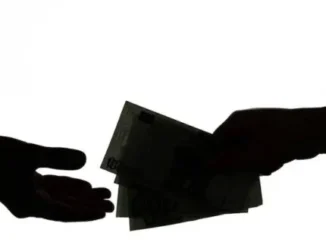Silhouette of hands exchanging money.