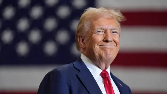 Man smiling with American flag background. Man smiling with American flag background.