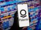Palantir logo on smartphone, colorful background.
