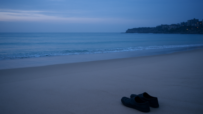 Shoes on sandy beach at dusk. Shoes on sandy beach at dusk.