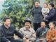 Group of people smiling outdoors together.