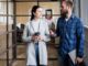 Two people talking in a modern office.