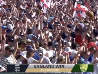 Crowd celebrating England's cricket victory.