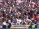 Crowd celebrating England's cricket victory.