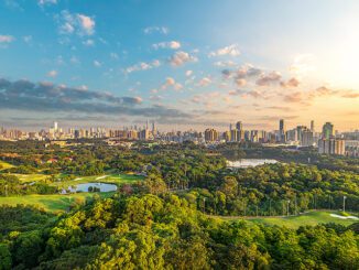 City skyline and golf course at sunset.