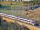 Train on bridge, text: Connecting Victoria.