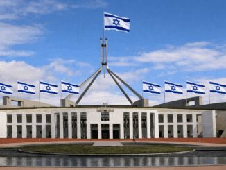 Parliament House with multiple Israeli flags flying.