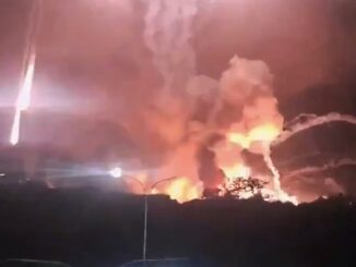 Fire and smoke in night sky scene.