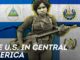 Woman soldier with rifle, Central American flags.