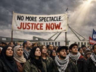Protesters holding Justice Now banner at rally.