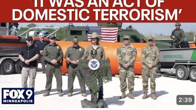 Officials standing in front of military vehicles.