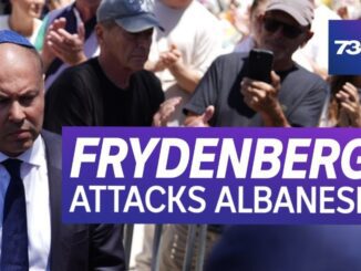 Politician crowd scene with news headline overlay.