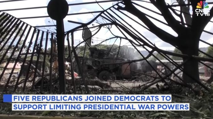 Damaged structure with news caption overlay.
