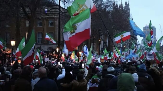 Protesters waving flags during a demonstration. Protesters waving flags during a demonstration.