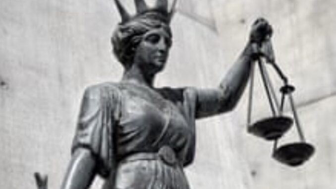Statue of Lady Justice with scales.