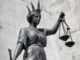 Statue of Lady Justice with scales.