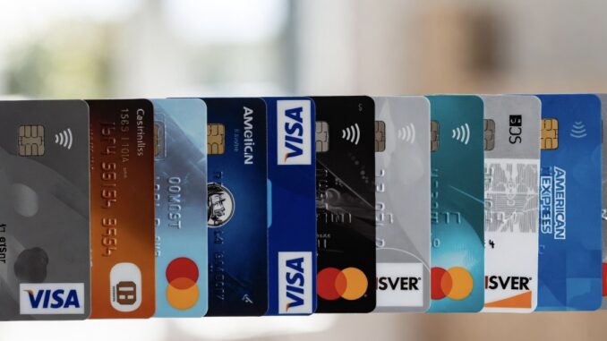 Various credit cards lined up in a row. Various credit cards lined up in a row.