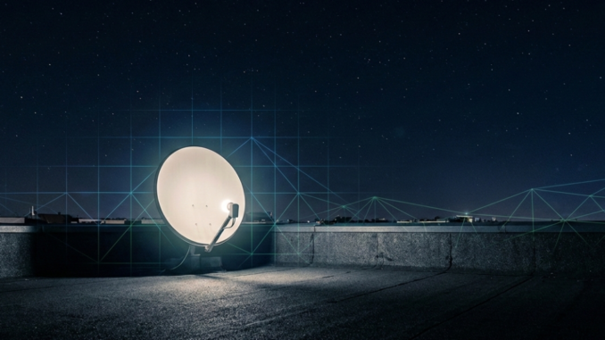 Satellite dish on rooftop under starry sky.
