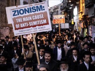 Protesters with signs on crowded street.