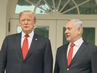 Two men in suits standing outside building.