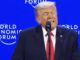 Blond-haired speaker at World Economic Forum podium
