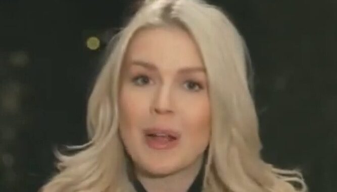 Person with long blonde hair speaking outdoors. Person with long blonde hair speaking outdoors.