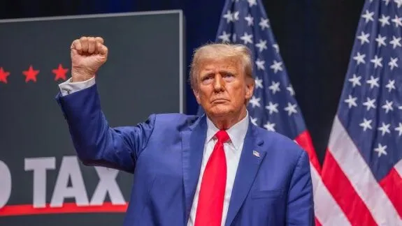 Politician in blue suit with raised fist Politician in blue suit with raised fist