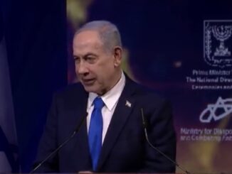 Man speaking at a podium, Israeli flag background.