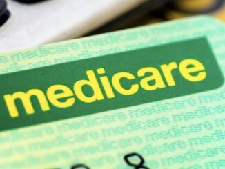Medicare card close-up with green design.
