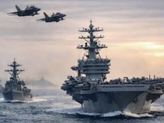 Aircraft carrier and jets at sea.