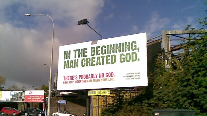 Billboard with atheistic message near road.