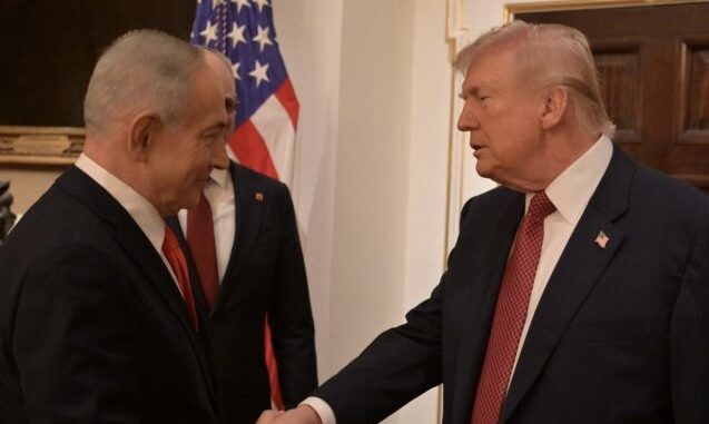 Two men shaking hands in formal setting. Two men shaking hands in formal setting.
