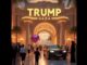 Luxurious building entrance with people and car.