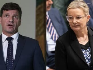 Man and woman in formal business attire.