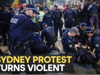 Police detain protestors during Sydney protest.