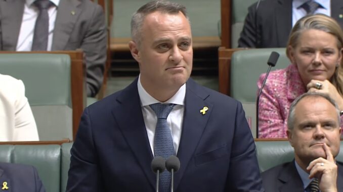 Man speaking at a government assembly podium. Man speaking at a government assembly podium.