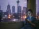 Person in scrubs using phone on train.