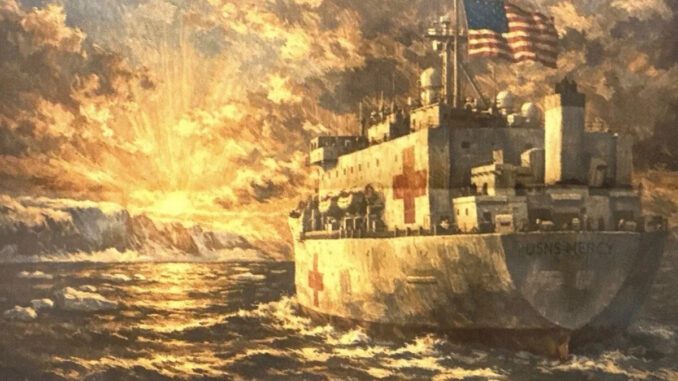 Ship sailing towards sunset with American flag.