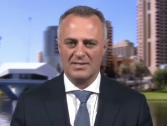 News interviewee in suit with riverside skyline