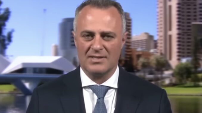 News interviewee in suit with riverside skyline