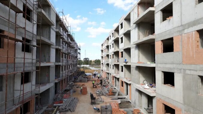 Construction site with partially built apartment buildings. Construction site with partially built apartment buildings.
