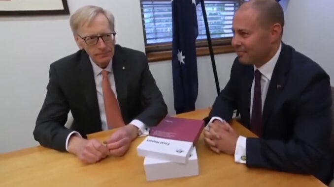 Two men sitting at a table, talking. Two men sitting at a table, talking.