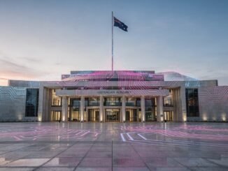 Parliament House with colorful light projections.
