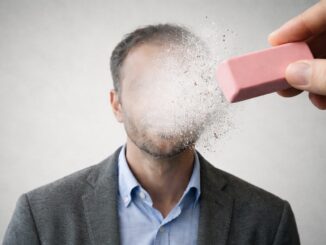 Face being erased with a pink eraser.