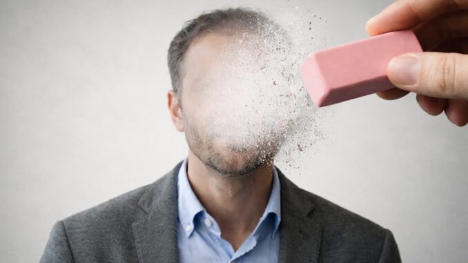 Face being erased with a pink eraser. Face being erased with a pink eraser.