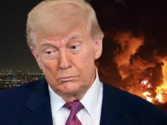 Concerned man with blazing fire behind him