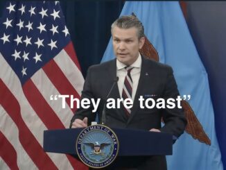 Speaker in suit before American flag, captioned